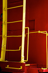 Image showing yellow ladder on red caboose