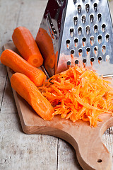 Image showing metal grater and carrot 