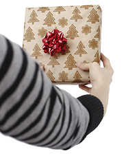 Image showing Young woman holding a present