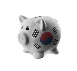 Image showing Ceramic piggy bank with painting of national flag 