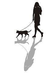 Image showing Woman with a cat on a leash