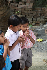 Image showing Group of young Bengali Catholics pray before a statue of the Blessed Virgin Mary, Basanti, West Bengal, India
