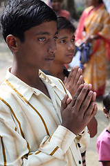 Image showing Group of young Bengali Catholics pray before a statue of the Blessed Virgin Mary, Basanti, West Bengal, India