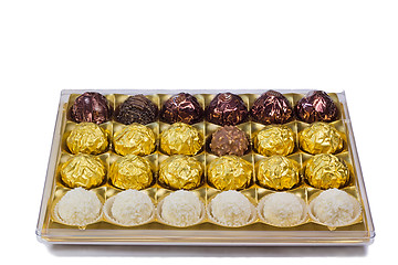 Image showing Chocolate sweets in the box on the white background.