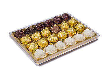 Image showing Chocolate sweets in the box on the white background.