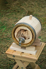 Image showing Wooden oak barrel wine, beer with metal crane. Sold at the fair.