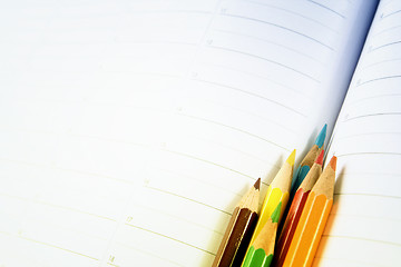 Image showing Color pencil and agenda