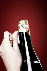 Image showing Opening champagne bottle