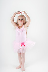 Image showing Little ballet dancer in pink doing pas