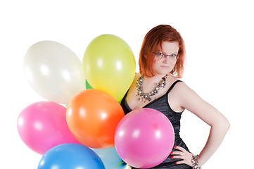 Image showing Beautiful woman keeping multicolored air balloons