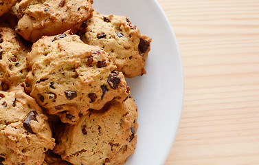 Image showing Closeup of fresh chocolate chip and pecan cookies