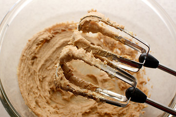 Image showing Creaming sugar and butter together with a hand mixer