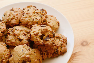 Image showing Plate of delicious pecan and chocolate chip cookies