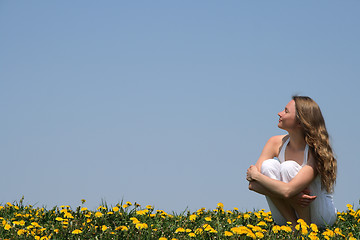 Image showing Young woman enjoying sunshine