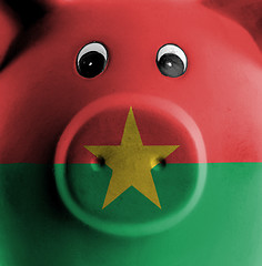 Image showing Ceramic piggy bank with painting of national flag 