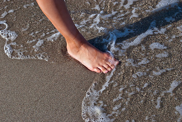 Image showing Foot on the sand.