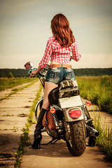 Image showing Biker girl and motorcycle