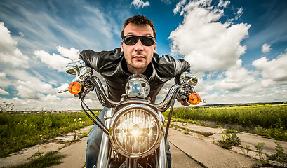 Image showing Funny Biker racing on the road