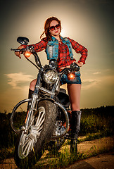 Image showing Biker girl and motorcycle