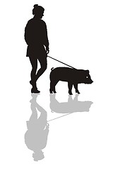 Image showing Woman with a pig on a leash