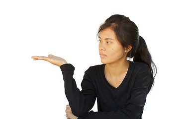 Image showing attractive asian young girl showing 