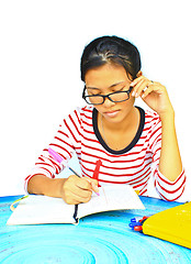 Image showing young girl  homework on the table