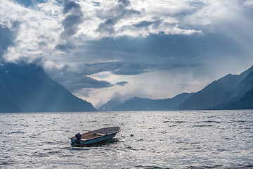 Image showing Fishing boat floating on water on fjord