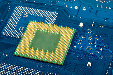 Image showing macro of computer processor on blue motherboard