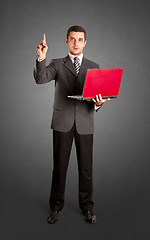 Image showing Business Man Shows Something With Finger