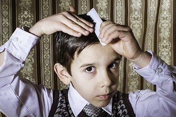 Image showing Child vintage clothes decided his hair