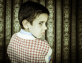 Image showing Frowning child vintage clothes.