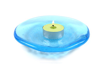 Image showing Candle on a blue glass dish