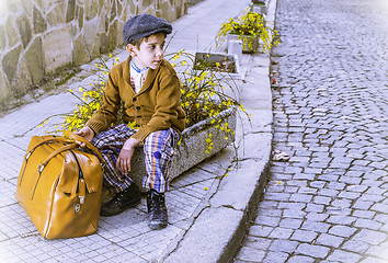 Image showing Child on a road with vintage bag