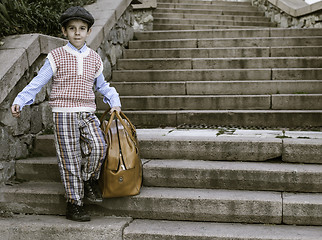 Image showing Exterior stairs and child with vintage bag