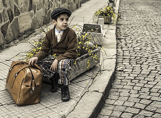 Image showing Child on a road with vintage bag