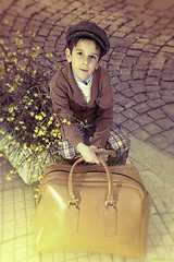 Image showing Child on a road with vintage bag