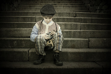 Image showing Child with vintage camera