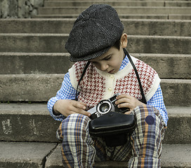 Image showing Child with vintage camera