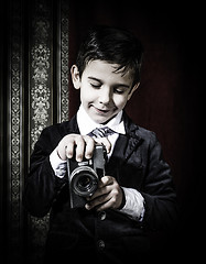 Image showing Child taking pictures with vintage camera