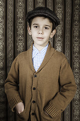 Image showing Smiling child in vintage clothes and hat