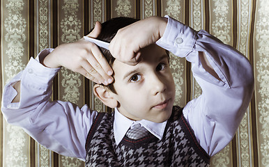 Image showing Child vintage clothes decided his hair