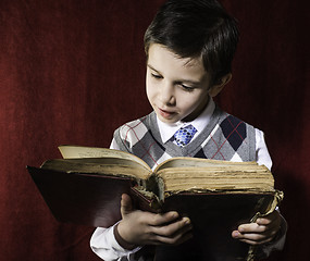 Image showing Child with red vintage book