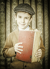 Image showing Child with red vintage book