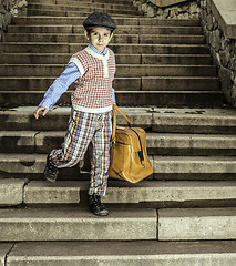 Image showing Exterior stairs and child with vintage bag