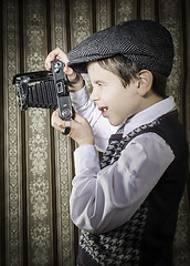 Image showing Child taking pictures with vintage camera