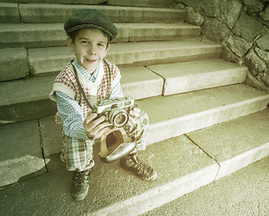 Image showing Child with vintage camera