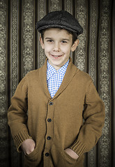 Image showing Smiling child in vintage clothes and hat