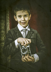 Image showing Child taking pictures with vintage camera