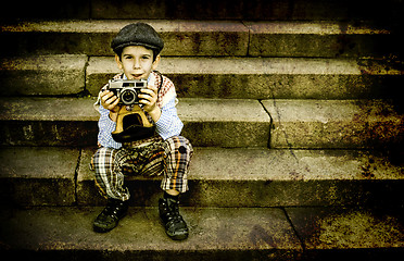 Image showing Child with vintage camera