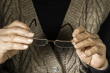 Image showing Women hands hold glasses